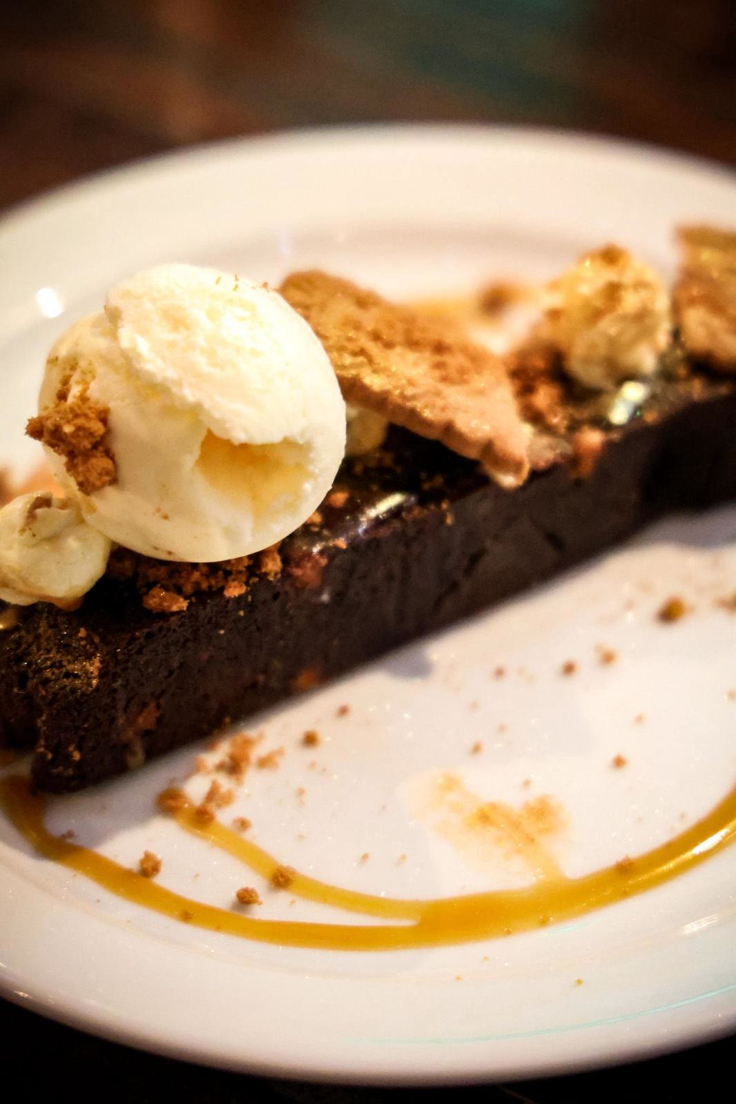 Warm chocolate dessert served with a scoop of ice cream